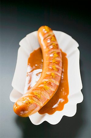 simsearch:659-01854698,k - Currywurst (sausage with ketchup & curry powder) in paper dish Stock Photo - Premium Royalty-Free, Code: 659-01862191