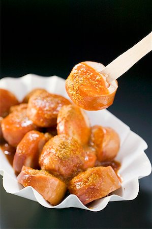 spices black background - Currywurst (sausage with ketchup & curry powder) in paper dish Stock Photo - Premium Royalty-Free, Code: 659-01862206