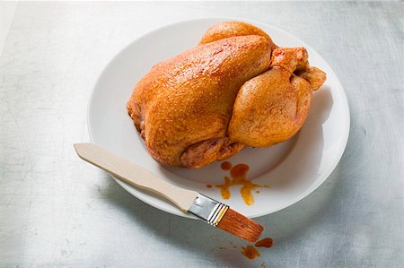 Fresh marinated chicken with basting brush Stock Photo - Premium Royalty-Free, Code: 659-01862249