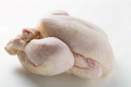 Fresh oven-ready chicken Fotografie stock - Premium Royalty-Free, Codice: 659-01862242