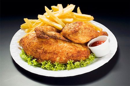 simsearch:659-01854801,k - Half a roast chicken with chips on paper plate Fotografie stock - Premium Royalty-Free, Codice: 659-01862274