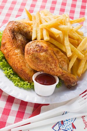 Half a roast chicken with chips on paper plate Stock Photo - Premium Royalty-Free, Code: 659-01862275