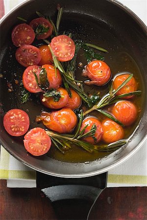 pan fried - Fried cherry tomatoes with rosemary in frying pan Stock Photo - Premium Royalty-Free, Code: 659-01862385