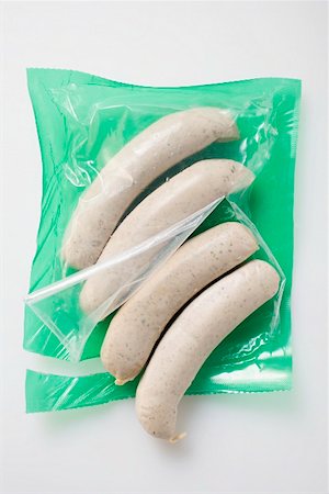 simsearch:659-02211855,k - Fresh sausages in opened packaging Fotografie stock - Premium Royalty-Free, Codice: 659-01862610