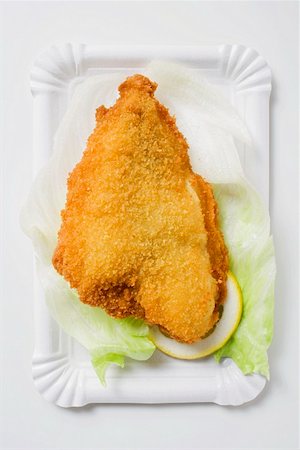 fried fish food - Breaded fish fillet on lettuce leaf and lemon Stock Photo - Premium Royalty-Free, Code: 659-01862641