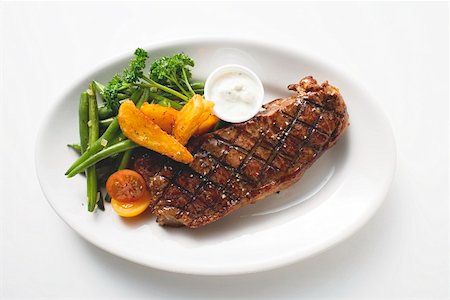 steak grilled from above - Grilled beef steak with vegetables and dip Stock Photo - Premium Royalty-Free, Code: 659-01862797