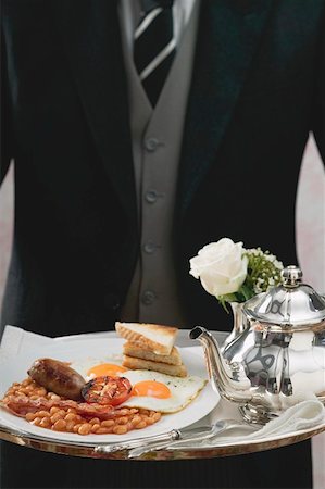 simsearch:659-01863975,k - Butler serving English breakfast on tray Stock Photo - Premium Royalty-Free, Code: 659-01862845