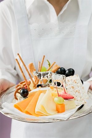 Waitress serving a cheese platter Stock Photo - Premium Royalty-Free, Code: 659-01862892