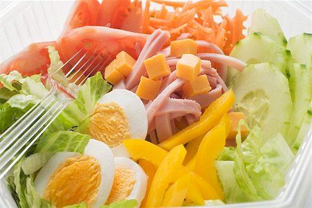 simsearch:659-01847361,k - Iceberg lettuce, ham, cheese, egg & vegetables in plastic bowl Stock Photo - Premium Royalty-Free, Code: 659-01862910