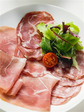 salame - Sausage platter with raw ham and salami from Italy Stock Photo - Premium Royalty-Free, Code: 659-01862935