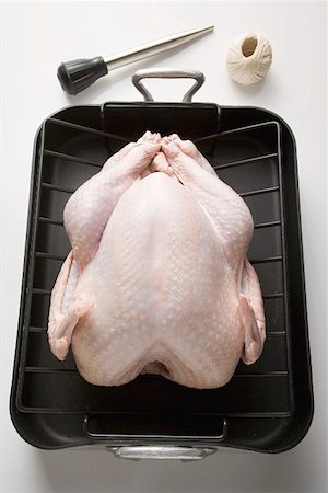 simsearch:659-01845311,k - Chicken in roasting tin, kitchen utensils beside it Stock Photo - Premium Royalty-Free, Code: 659-01863010