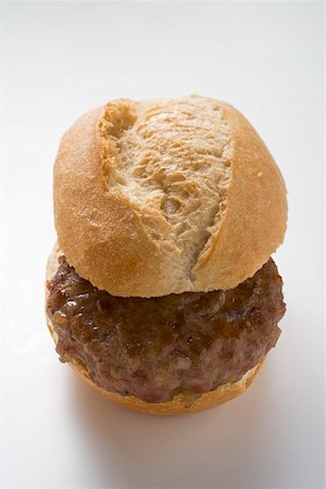 simsearch:659-01848338,k - Burger in a bread roll Stock Photo - Premium Royalty-Free, Code: 659-01863041