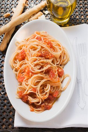 simsearch:659-01863699,k - Spaghetti with tomato sauce, olive oil, grissini Stock Photo - Premium Royalty-Free, Code: 659-01863140