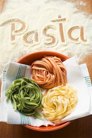 Home-made ribbon pasta and the word 'Pasta' Stock Photo - Premium Royalty-Free, Code: 659-01863283