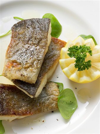 Fried trout with lemon (overhead view) Stock Photo - Premium Royalty-Free, Code: 659-01863348