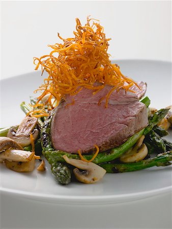 fillet beef recipes - Beef steak with green asparagus and mushrooms Stock Photo - Premium Royalty-Free, Code: 659-01863415