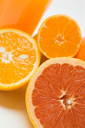 simsearch:659-03534033,k - Verre de jus d'orange, de pamplemousse et d'orange Photographie de stock - Premium Libres de Droits, Code: 659-01863546