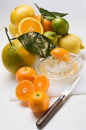 simsearch:659-03525022,k - Assorted citrus fruit with citrus squeezer and knife Stock Photo - Premium Royalty-Free, Code: 659-01863542