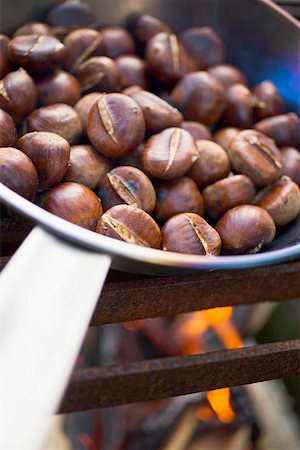 roasted (not meat) - Roasting chestnuts Stock Photo - Premium Royalty-Free, Code: 659-01863578