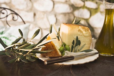 simsearch:659-01859830,k - Cheese, green olives and olive oil on table out of doors Stock Photo - Premium Royalty-Free, Code: 659-01863605