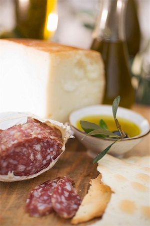 simsearch:659-09125440,k - Salami, crackers, olives, olive oil and Parmesan Stock Photo - Premium Royalty-Free, Code: 659-01863630