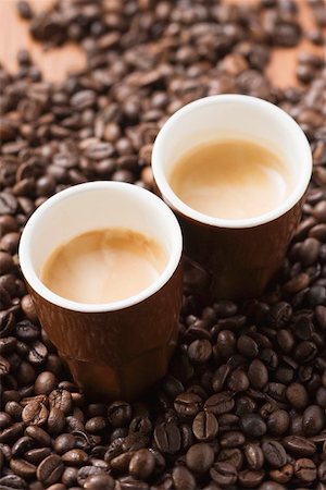 Two cups of espresso on coffee beans Stock Photo - Premium Royalty-Free, Code: 659-01863806