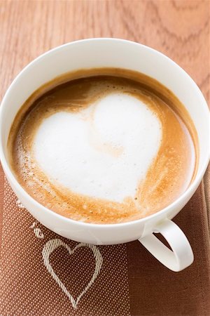 simsearch:659-08419484,k - Cup of coffee with milk froth in shape of heart (overhead) Stock Photo - Premium Royalty-Free, Code: 659-01863832