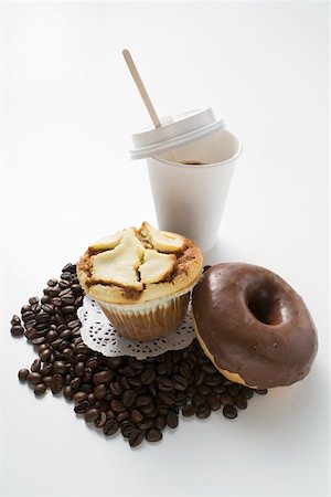 donuts and coffee - Muffin, doughnut, coffee beans and a plastic cup of coffee Stock Photo - Premium Royalty-Free, Code: 659-01863915