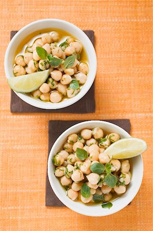 Chick-peas with lime wedges and herbs Stock Photo - Premium Royalty-Free, Code: 659-02214061