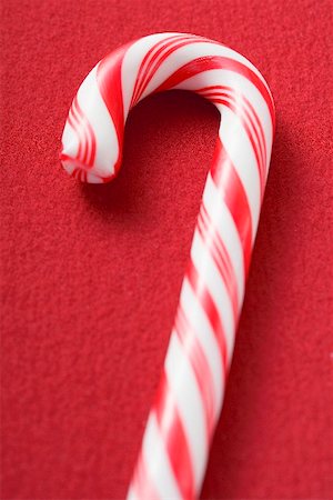 streak - Candy cane on red background Stock Photo - Premium Royalty-Free, Code: 659-02214096
