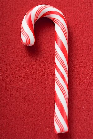 reddy - Candy cane on red background Stock Photo - Premium Royalty-Free, Code: 659-02214097