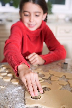 Girl cutting out biscuits Stock Photo - Premium Royalty-Free, Code: 659-02214197