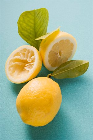 Lemons, whole, halved and squeezed Stock Photo - Premium Royalty-Free, Code: 659-02214269