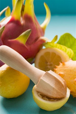 simsearch:659-02210797,k - Lemons with citrus squeezer, pitahaya and horned melon Stock Photo - Premium Royalty-Free, Code: 659-02214273