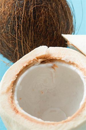 simsearch:659-02213538,k - The flesh of a coconut in front of whole coconut Foto de stock - Sin royalties Premium, Código: 659-02214286