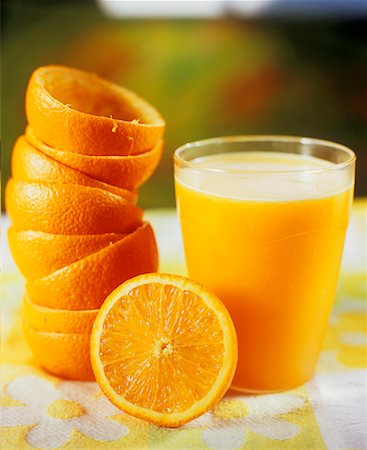simsearch:659-02213273,k - A glass of orange juice with squeezed oranges Stock Photo - Premium Royalty-Free, Code: 659-02210789