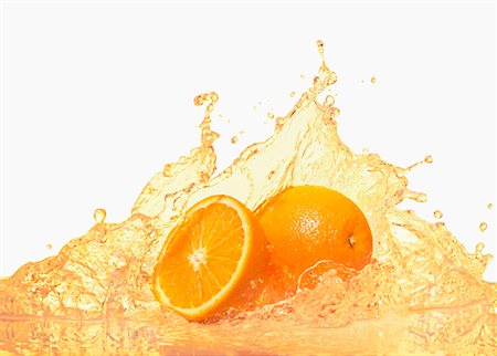 Oranges with splashing orange juice Stock Photo - Premium Royalty-Free, Code: 659-02210939