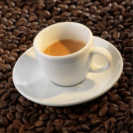 simsearch:659-03529865,k - A cup of espresso on coffee beans Stock Photo - Premium Royalty-Free, Code: 659-02210952
