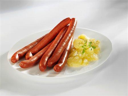 Debreziner sausages with potato salad Foto de stock - Sin royalties Premium, Código: 659-02211167