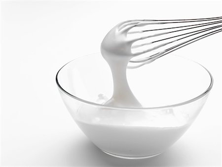 Whipped cream in bowl with whisk Stock Photo - Premium Royalty-Free, Code: 659-02211285