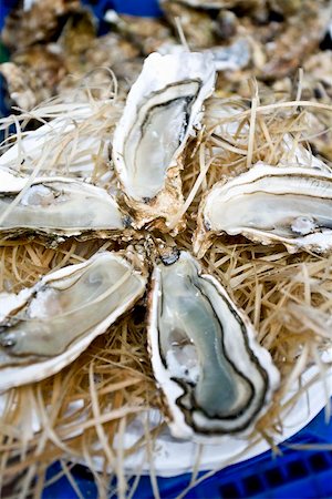 raw oyster - Opened oysters on a market stall Stock Photo - Premium Royalty-Free, Code: 659-02211287