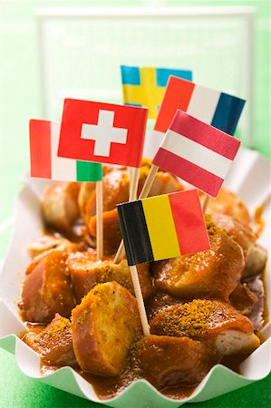 fried sausage - Currywurst (sausage with curry sauce) with European flags Stock Photo - Premium Royalty-Free, Code: 659-02211338