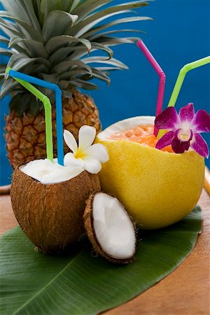 fruits of the caribbean - Iced drinks in hollowed-out coconut and grapefruit Stock Photo - Premium Royalty-Free, Code: 659-02211374