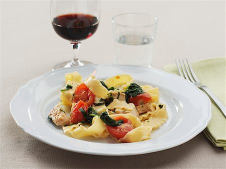 spinach pasta - Ribbon pasta with pork, spinach and cocktail tomatoes Stock Photo - Premium Royalty-Free, Code: 659-02211445