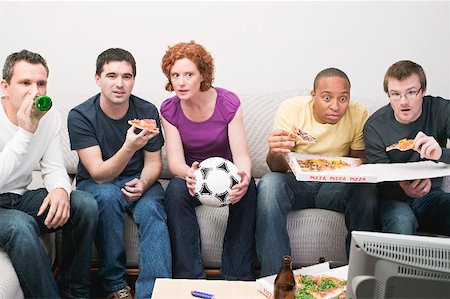 eating pizza, sports - Friends with football, pizza & beer sitting in front of TV Stock Photo - Premium Royalty-Free, Code: 659-02211458
