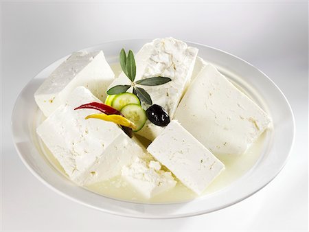 feta - Several pieces of feta cheese in brine Stock Photo - Premium Royalty-Free, Code: 659-02211586