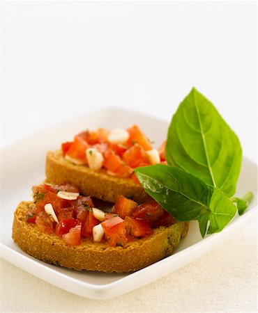 Two bruschetta with tomato salsa Stock Photo - Premium Royalty-Free, Code: 659-02211606