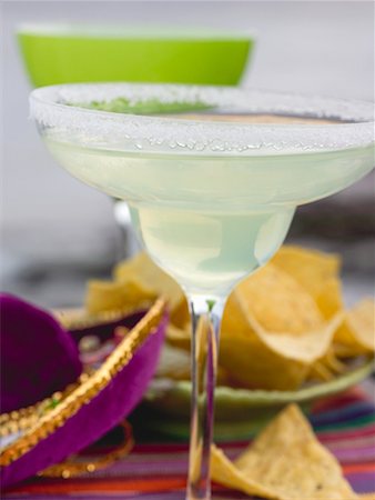 Margarita in glass with salted rim, tortilla chips (Mexico) Stock Photo - Premium Royalty-Free, Code: 659-02211718