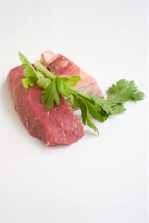 Piece of beef, bone and parsley Stock Photo - Premium Royalty-Free, Code: 659-02211948