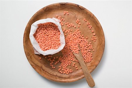 red lentil - Red lentils on wooden plate and in bag Stock Photo - Premium Royalty-Free, Code: 659-02212189